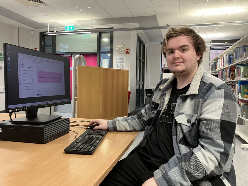 IT Student Ryan Robertson using a computer in the SERC Lisburn Campus Library.